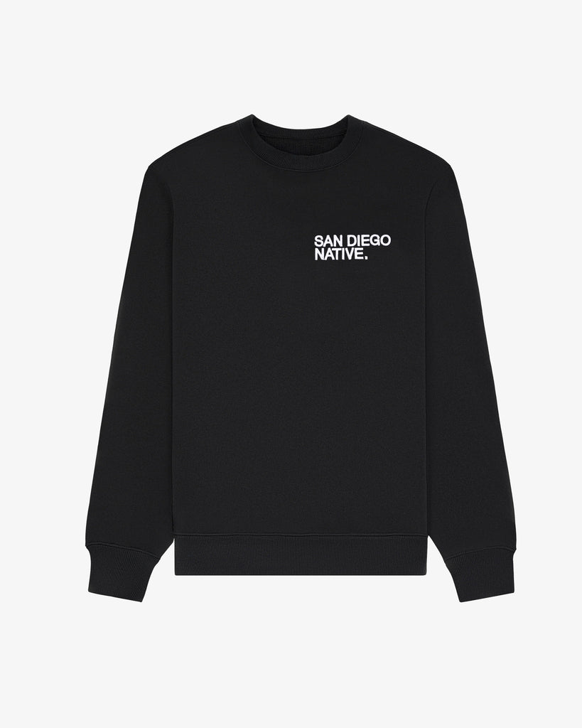 Front view of The SDN. Brand Souvenir Crew — heavyweight French terry pullover with puff-embroidered stacked logo on chest.